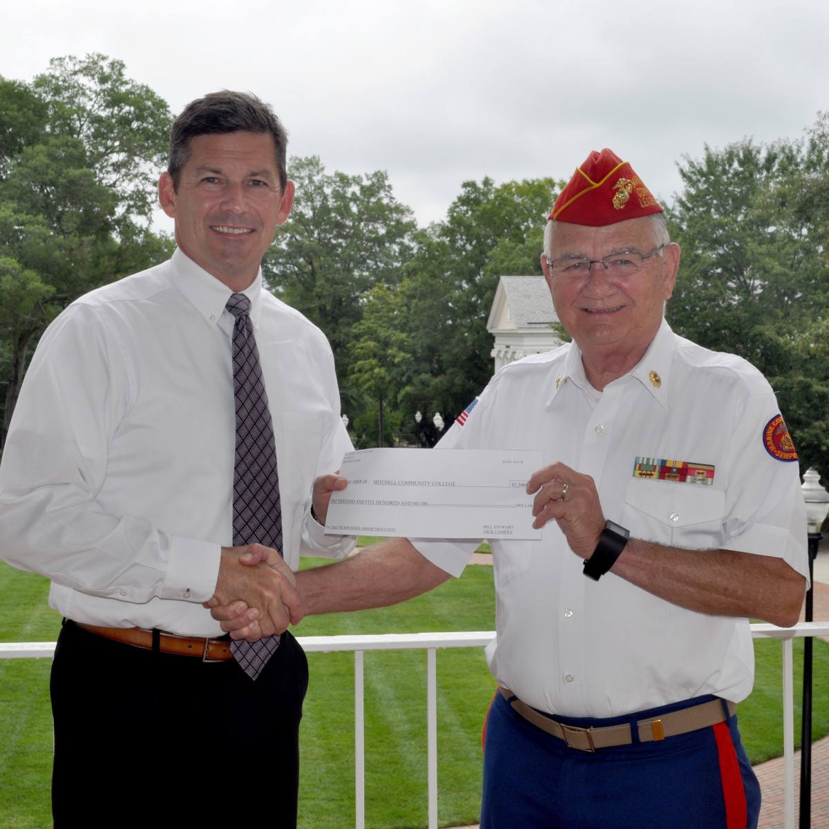 Dr. Tim Brewer, President, Mitchell Community College and Dick Camery, Commandant, Marine Corps League of Iredell County