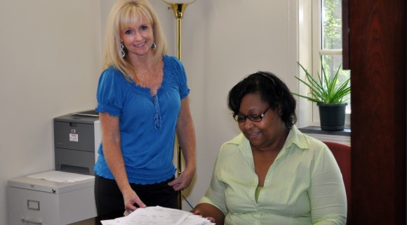 Two financial Aid staff members.