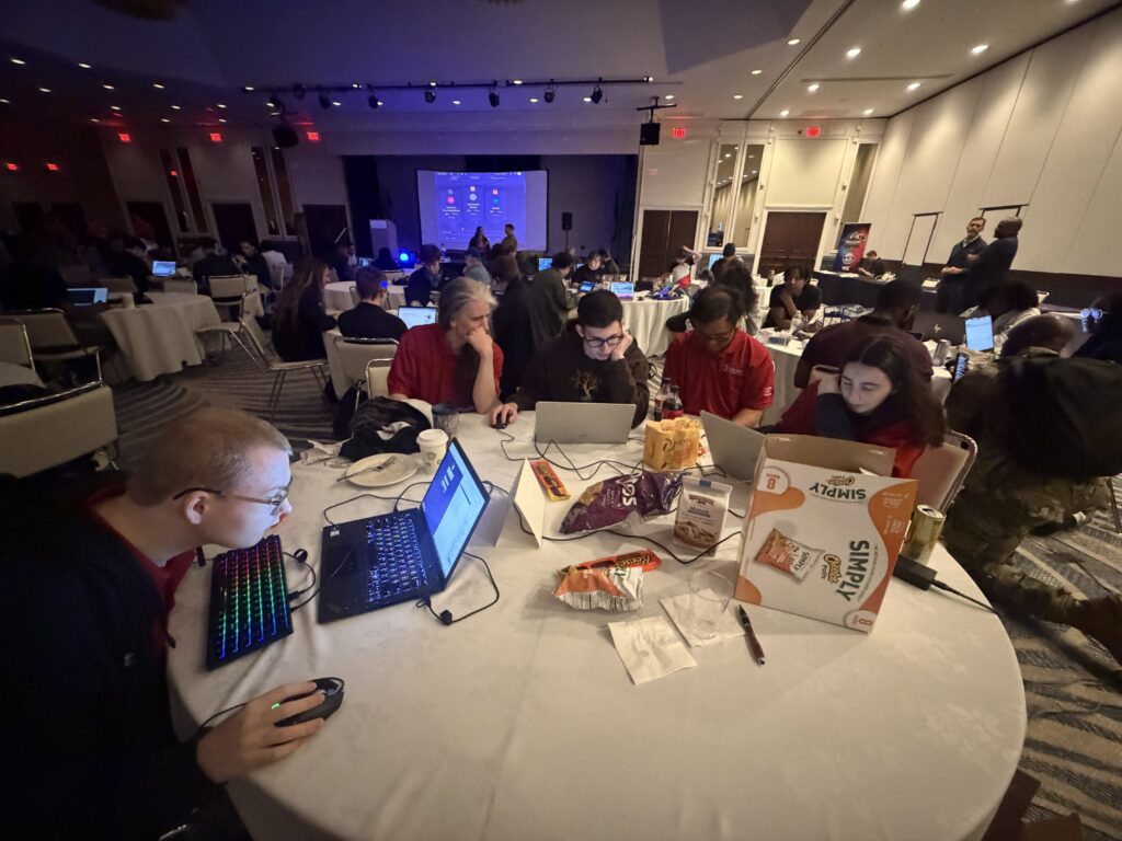 This is a photo of students competing at the 2026 Minutemen Cyber Cup Competition.