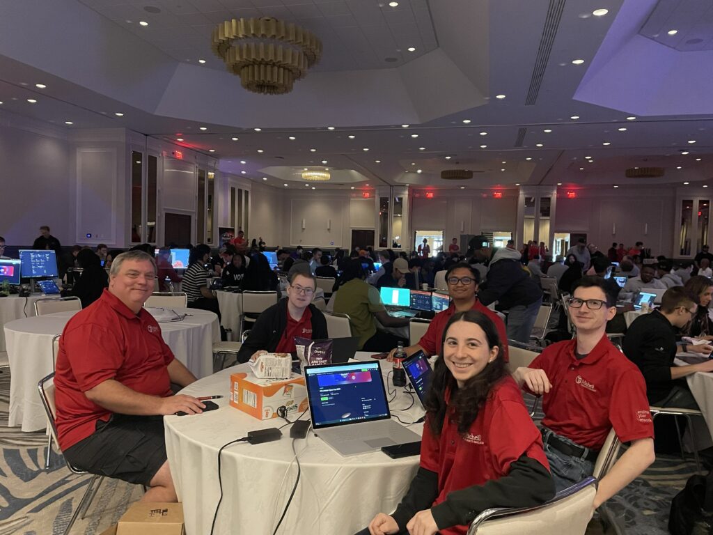 This is a photo of students competing at the 2026 Minutemen Cyber Cup Competition.