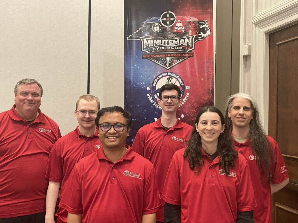 This is a photo of students competing at the 2026 Minutemen Cyber Cup Competition.